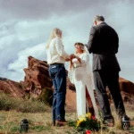 Adventure couple elopement photography at Red Rocks Colorado capturing motorcycle riders and romantic outdoor wedding portraits