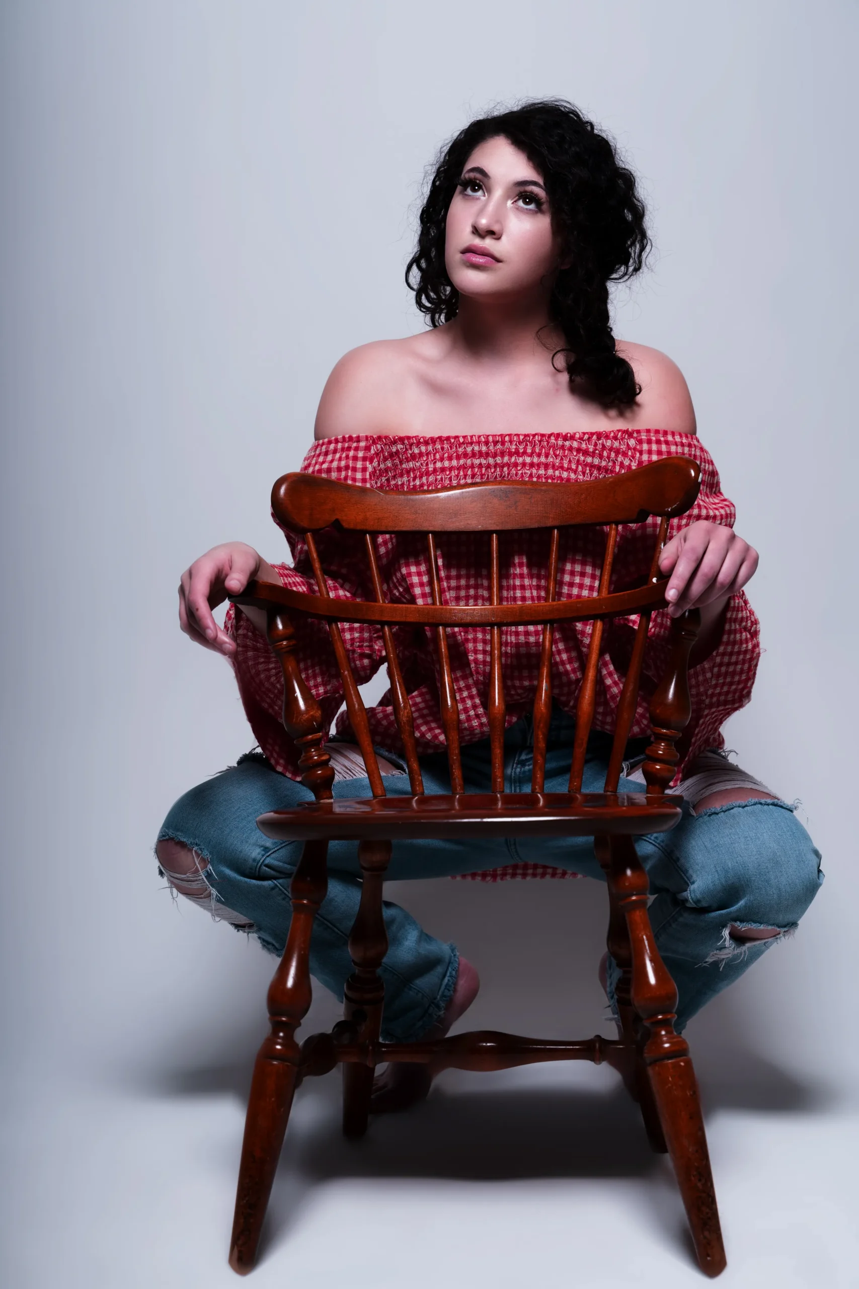 Home 50 studio portrait chair dramatic lighting denver scaled